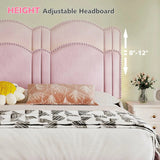 Close-up of adjustable height upholstered headboard with nailhead trim.